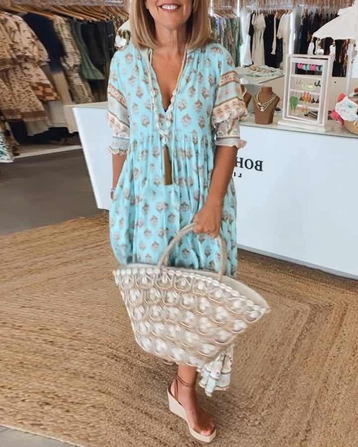 MANA | CHIQUE MIDI-JURK MET BLOEMENPRINT EN V-HALS