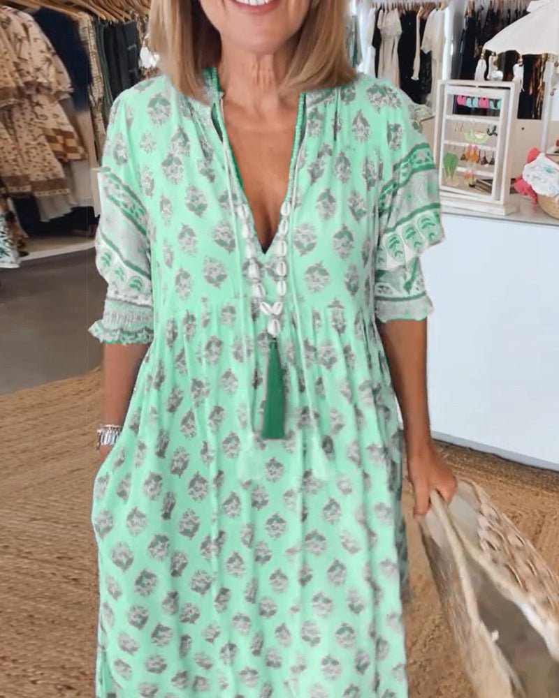 MANA | CHIQUE MIDI-JURK MET BLOEMENPRINT EN V-HALS